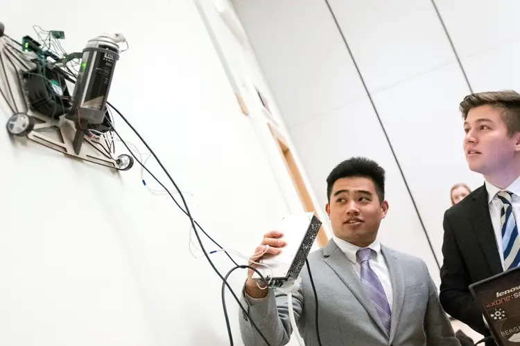 CMU students demonstrate a robot climb as part of student services. 